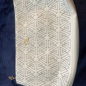 white faux leather wristlet bag cosmetic case fret work clutch